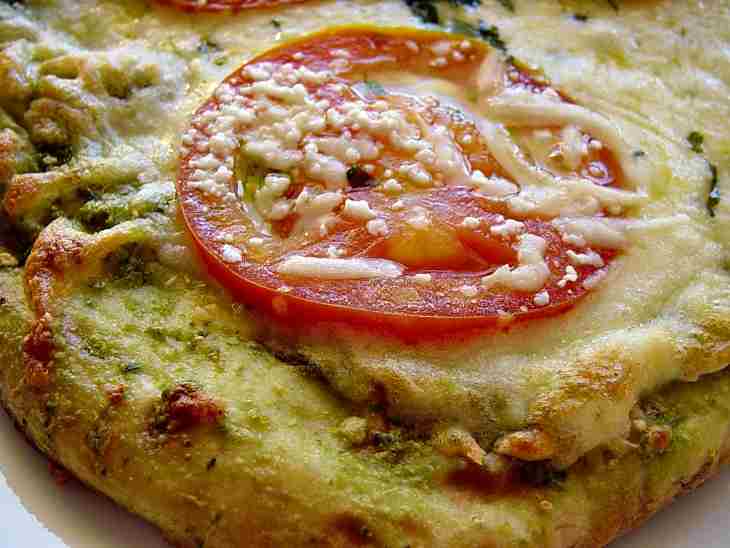 Delicious Cheesy Pizza With Herbs And Fresh Tomatoes